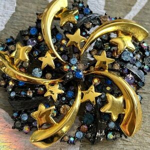 JOAN RIVERS Gold and Black Starburst star Brooch